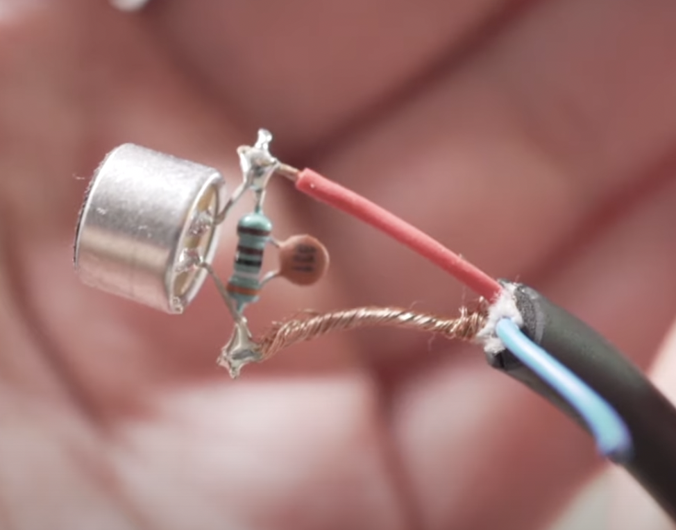 capacitor parallel with resistor between both capsule legs